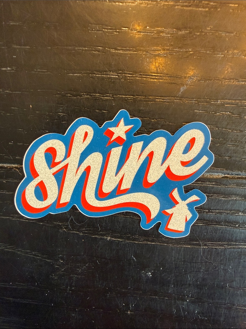 Dutch Bros Shine Sticker in Blue, Red and Silver